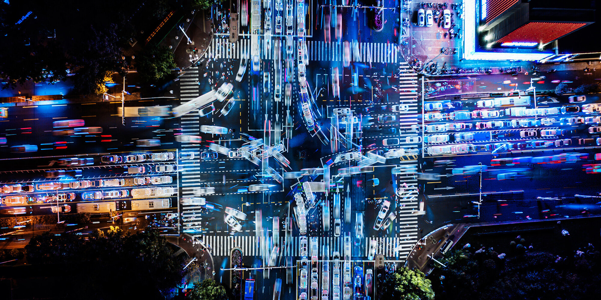 Drone Point View of City Street Crossing at Night