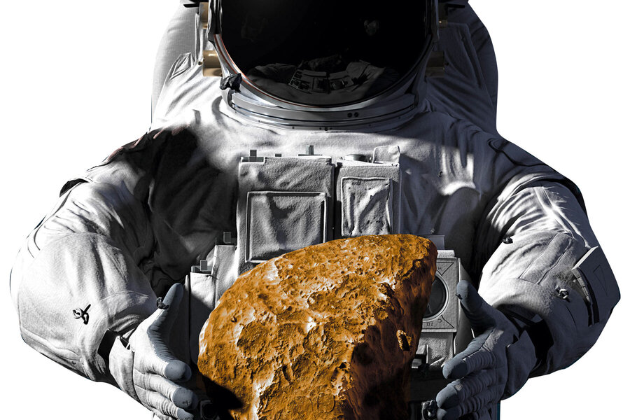 Astronaut im Raumanzug mit Gesteinsbrocken in der Hand